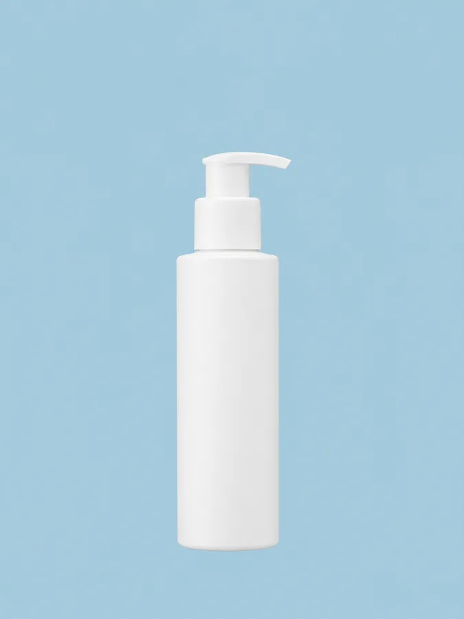 White pump bottle for a skin care product, shown upright on a pale blue background